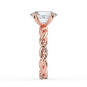 The Elysande Ring – Oval Solitaire with Braided Band in 18K Rose Gold – The Jewel Concierge