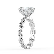 The Elysande Ring – Oval Solitaire with Braided Band in 14K White Gold and Yellow Gold – The Jewel Concierge