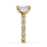 The Elysande Ring – Emerald Solitaire with Braided Pavé Band in 18K Yellow Gold – The Jewel Concierge