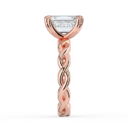 The Elysande Ring – Emerald Solitaire with Braided Band in 18K Rose Gold – The Jewel Concierge