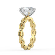 The Elysande Ring – Oval Solitaire with Braided Band in 18K White Gold and Yellow Gold – The Jewel Concierge