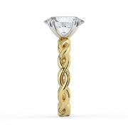 The Elysande Ring – Oval Solitaire with Braided Band in Platinum – The Jewel Concierge