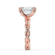 The Elysande Ring – Radiant Solitaire with Braided Band in 18K Rose Gold – The Jewel Concierge