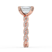 The Elysande Ring – Emerald Solitaire with Braided Pavé Band in 18K Rose Gold – The Jewel Concierge