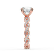 The Elysande Ring – Round Solitaire with Braided Pavé Band in 18K Rose Gold – The Jewel Concierge