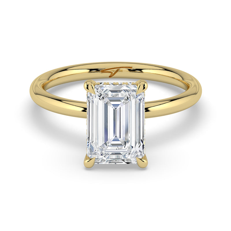 The Celeste Ring – Emerald Solitaire with Hidden Halo in 14K Yellow Gold – The Jewel Concierge