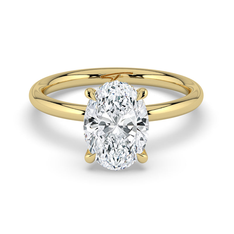 The Celeste Ring – Oval Solitaire with Hidden Halo in 14K Yellow Gold – The Jewel Concierge