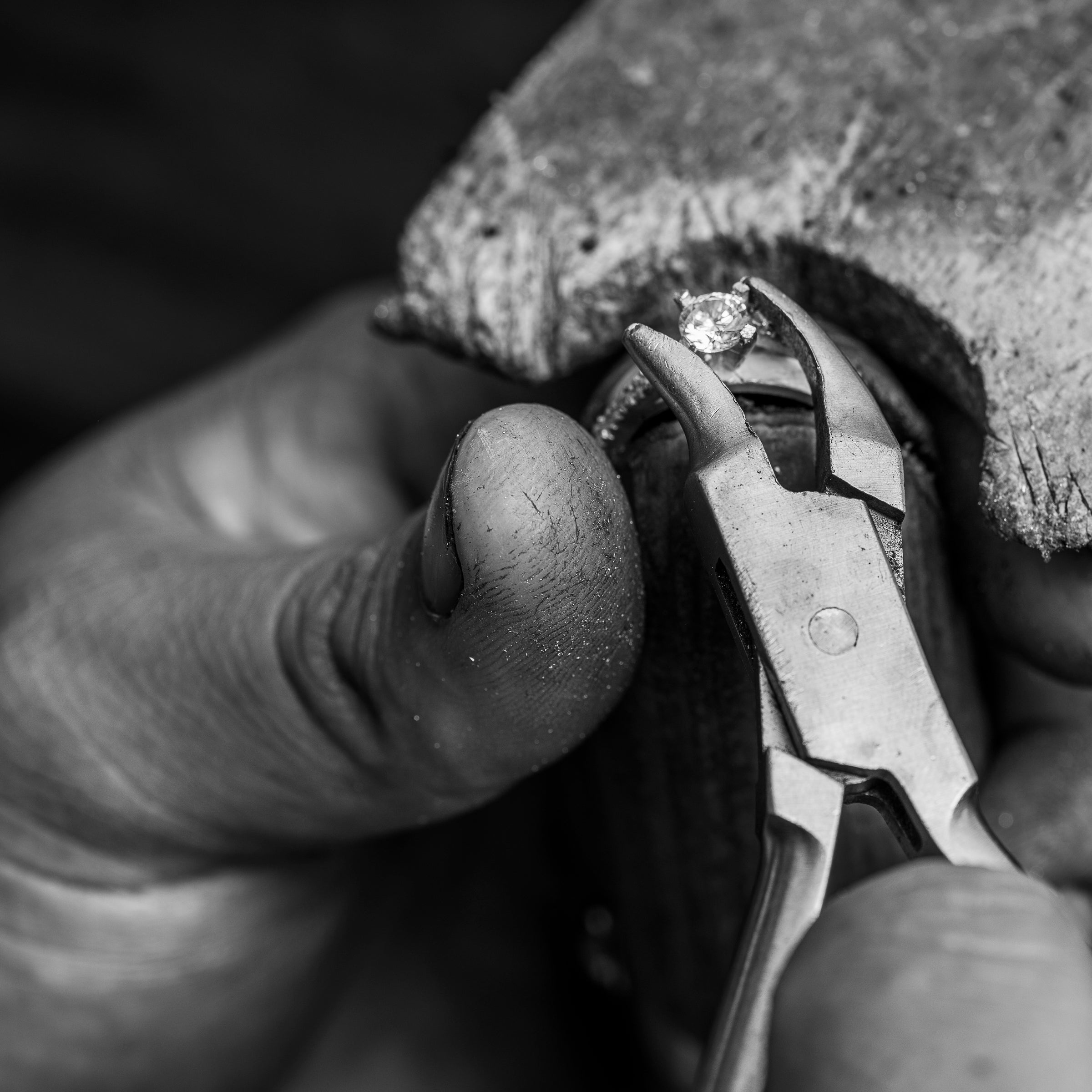 jeweller setting a diamond into a ring