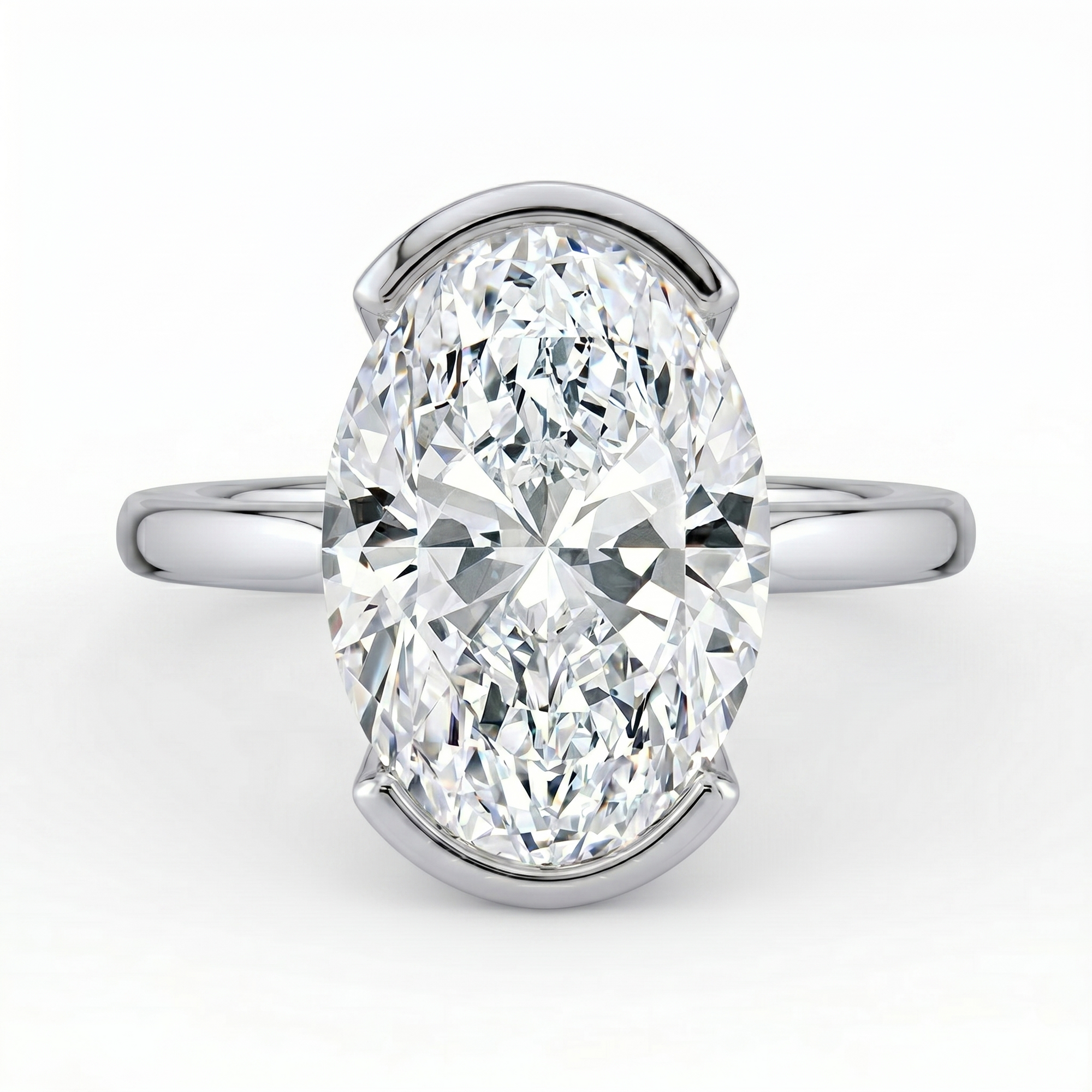 The Celine Ring – Oval Half Bezel Solitaire in 18K White Gold – The Jewel Concierge