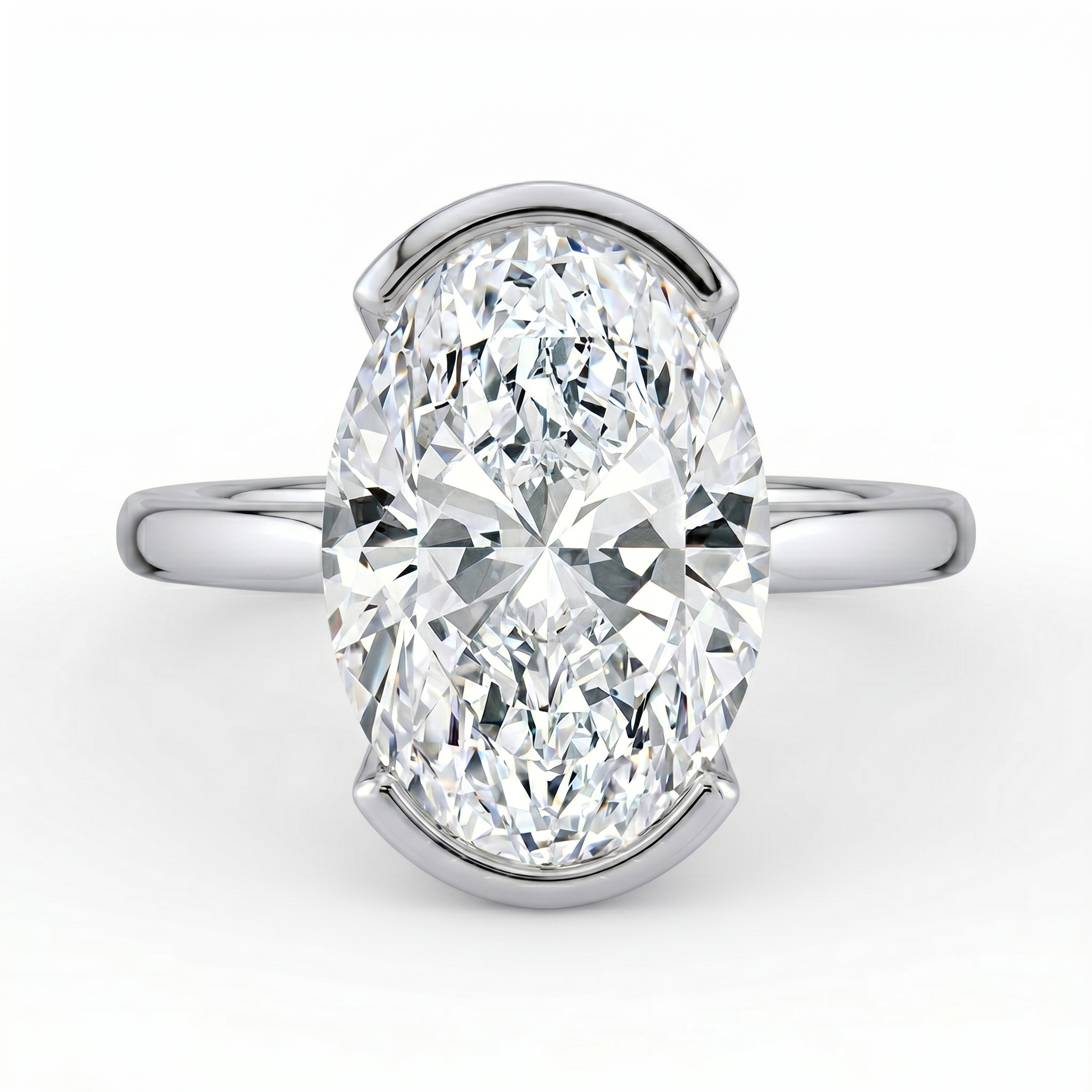 The Celine Ring – Oval Half Bezel Solitaire in 18K White Gold – The Jewel Concierge
