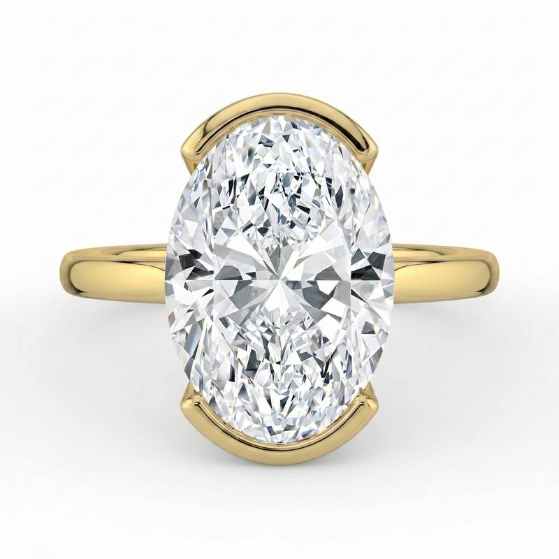 The Celine Ring – Oval Half Bezel Solitaire in 18K Yellow Gold – The Jewel Concierge