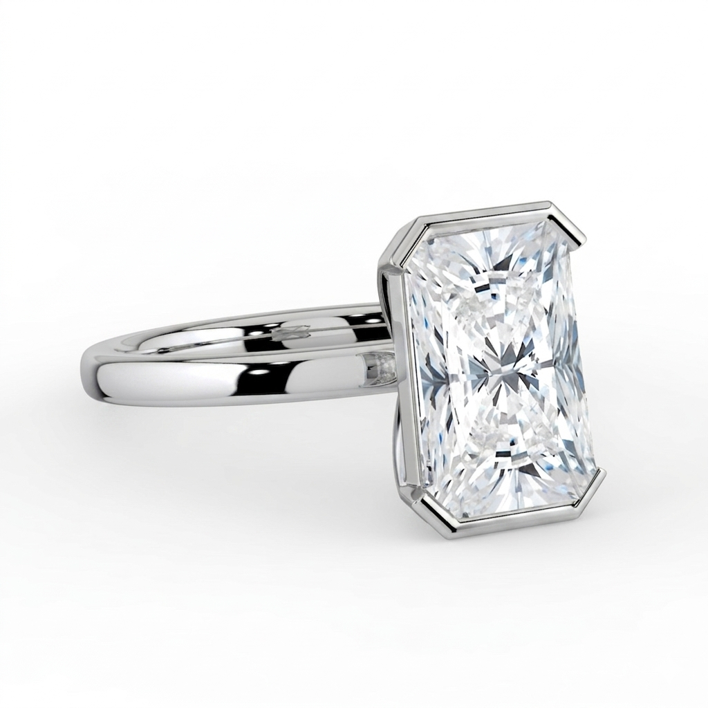 The Celine Ring – Oval Half Bezel Solitaire in 18K White Gold – The Jewel Concierge