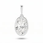 The Odette Pendant - oval-cut lab-grown diamond pendant in a bezel setting shown against a plain white background - The Jewel Concierge