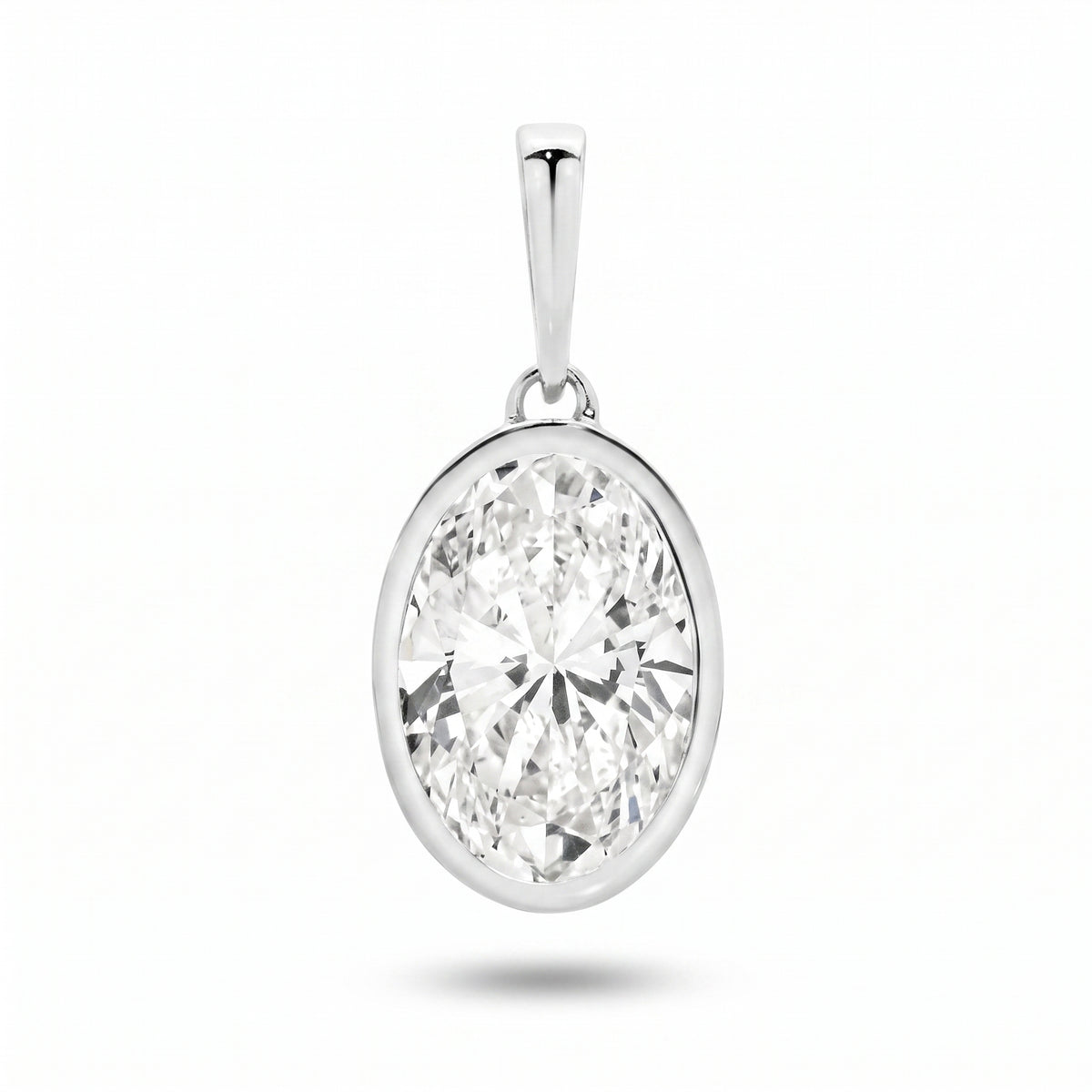 The Odette Pendant - oval-cut lab-grown diamond pendant in a bezel setting shown against a plain white background - The Jewel Concierge