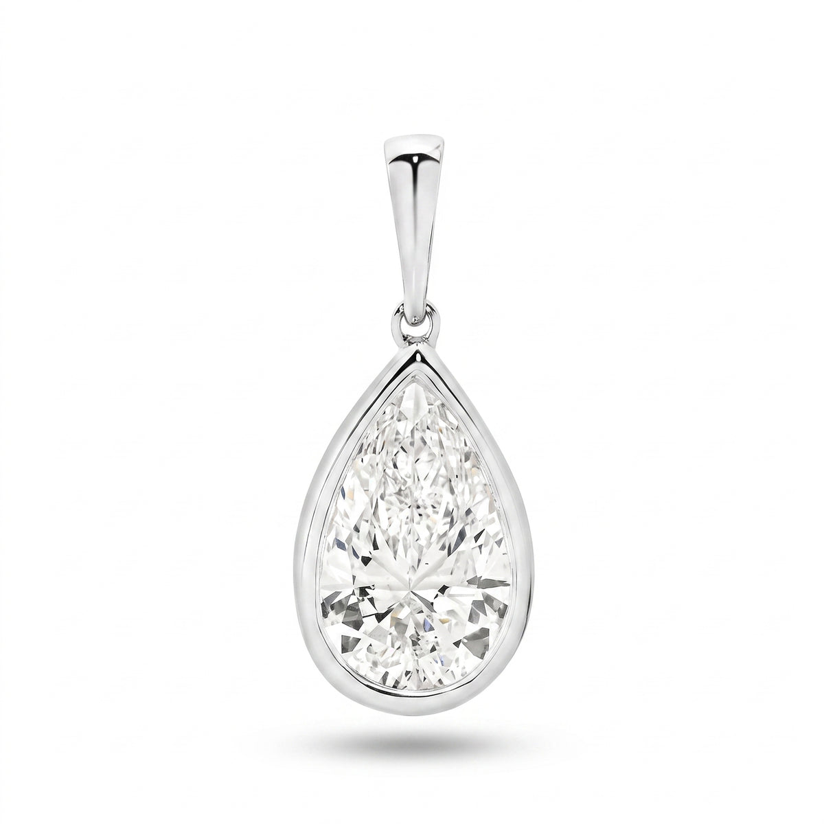 The Odette Pear Bezel Pendant - pear-cut lab-grown diamond pendant in a bezel setting shown against a plain white background - The Jewel Concierge