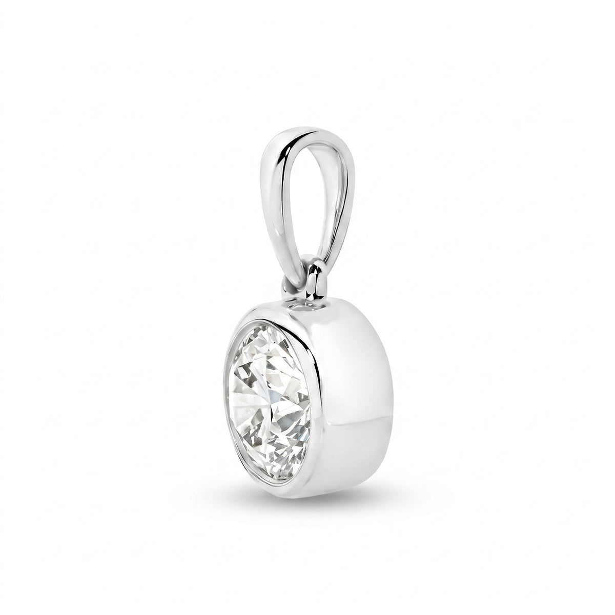 The Odette Round Bezel Pendant - Round-cut lab-grown diamond pendant in a bezel setting shown against a plain white background - The Jewel Concierge