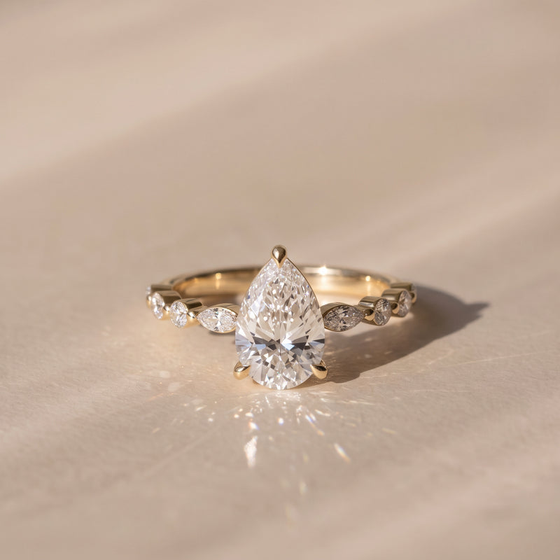 The Vega Ring — Pear with Marquise & Round Accents Lab-Grown Diamond Engagement Ring in Yellow Gold | The Jewel Concierge
