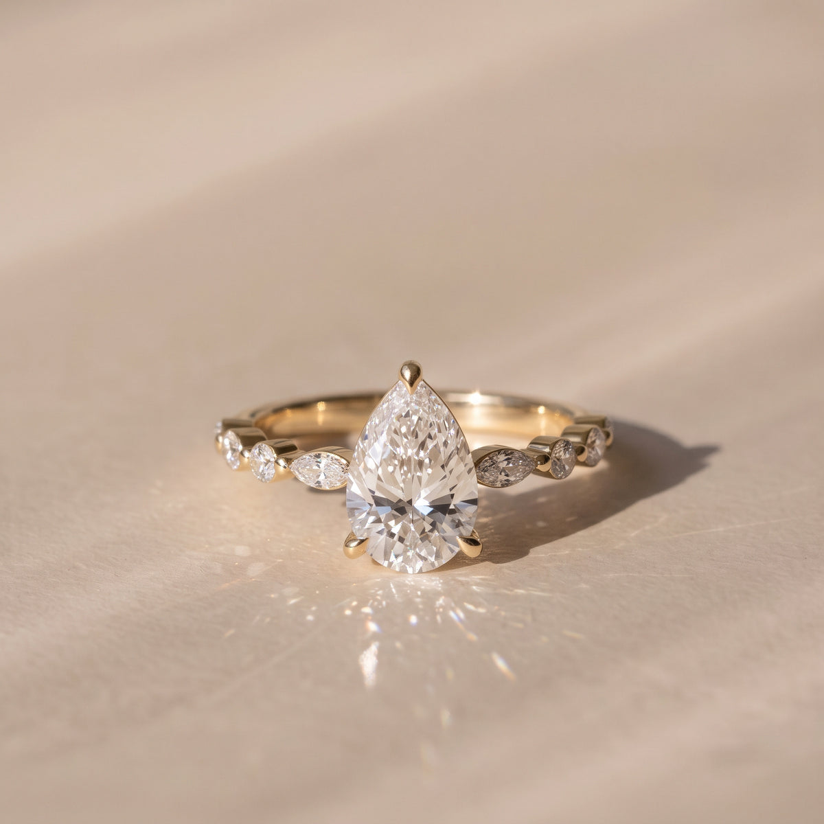 The Vega Ring — Pear with Marquise & Round Accents Lab-Grown Diamond Engagement Ring in Yellow Gold | The Jewel Concierge
