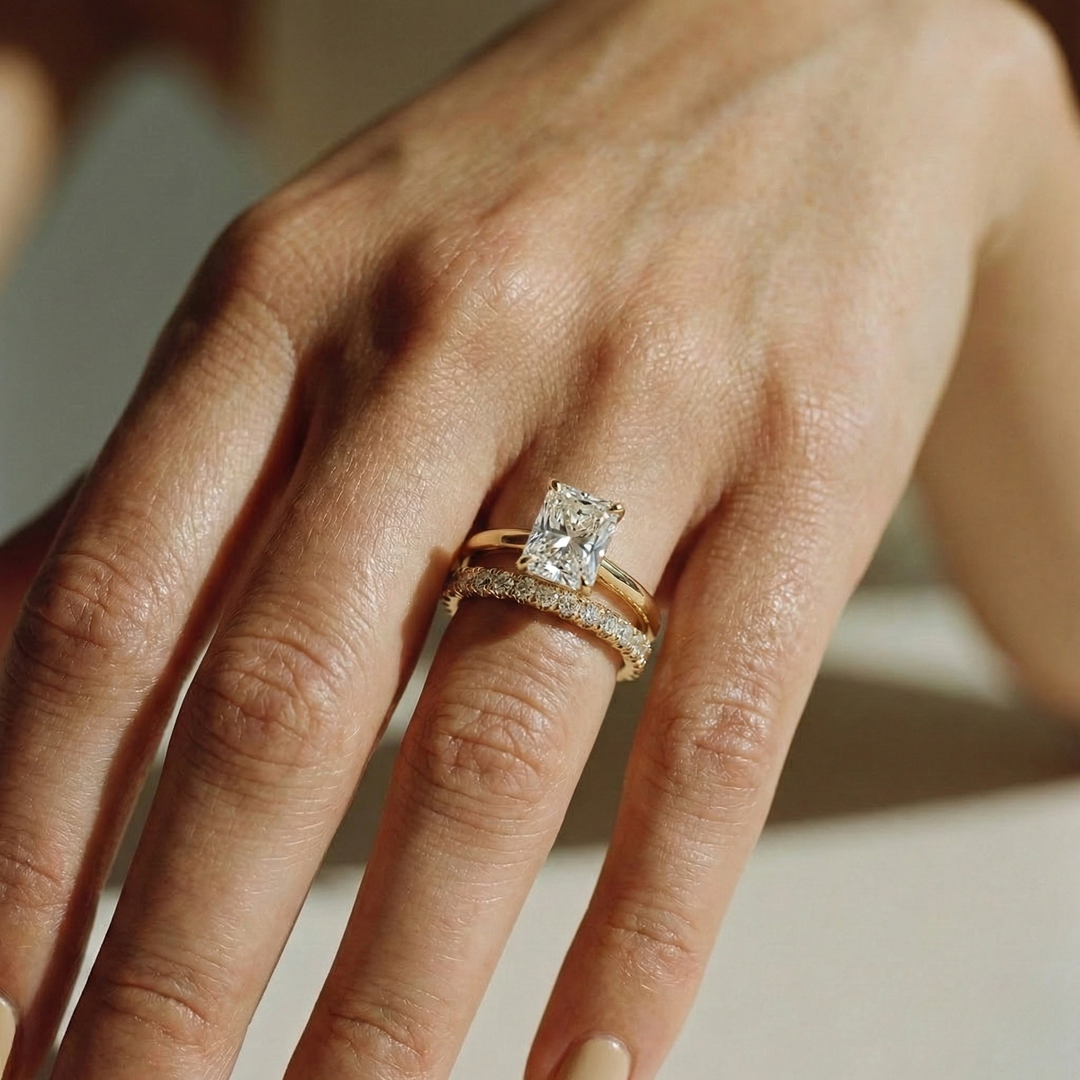 Yellow gold radiant solitaire ring with pavé wedding band | The Jewel Concierge