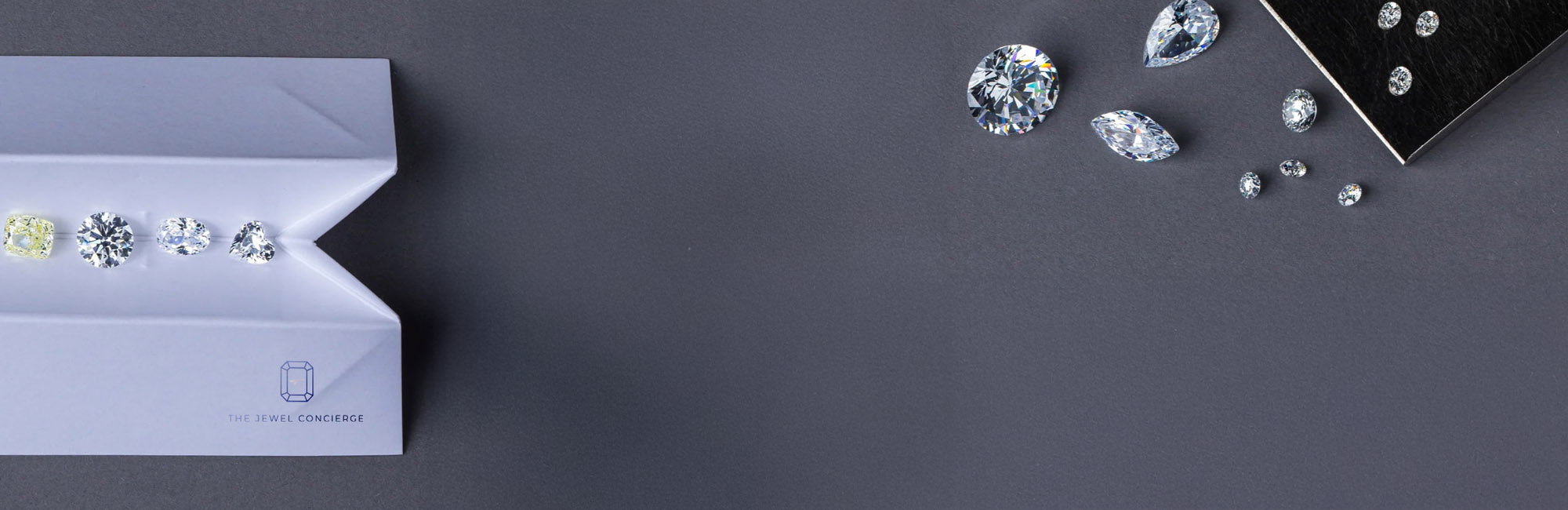 various diamonds on a diamond envelope on a blue greyish background