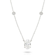 A white gold necklace featuring a delicate chain with five small round bezel-set lab-grown diamonds spaced along the chain, ending with an oval-cut lab-grown diamond solitaire pendant, shown on a white background - The Jewel Concierge