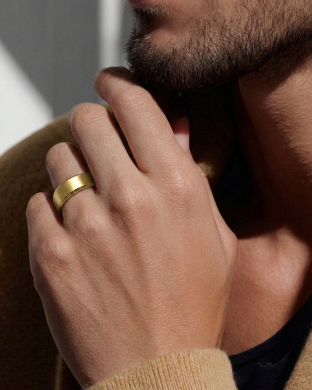 man wearing a yellow gold wedding band with bevelled edges | The Jewel Concierge