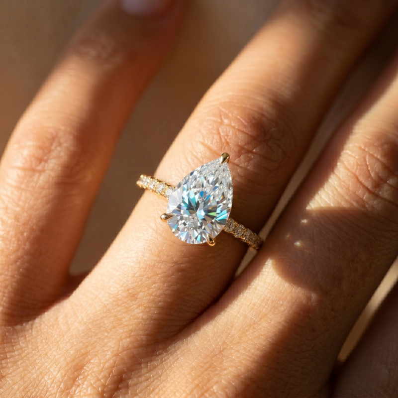 The Phoenix Ring – Pear Solitaire with Hidden Halo & Pavé Band in 18K Yellow Gold and Rose Gold – The Jewel Concierge