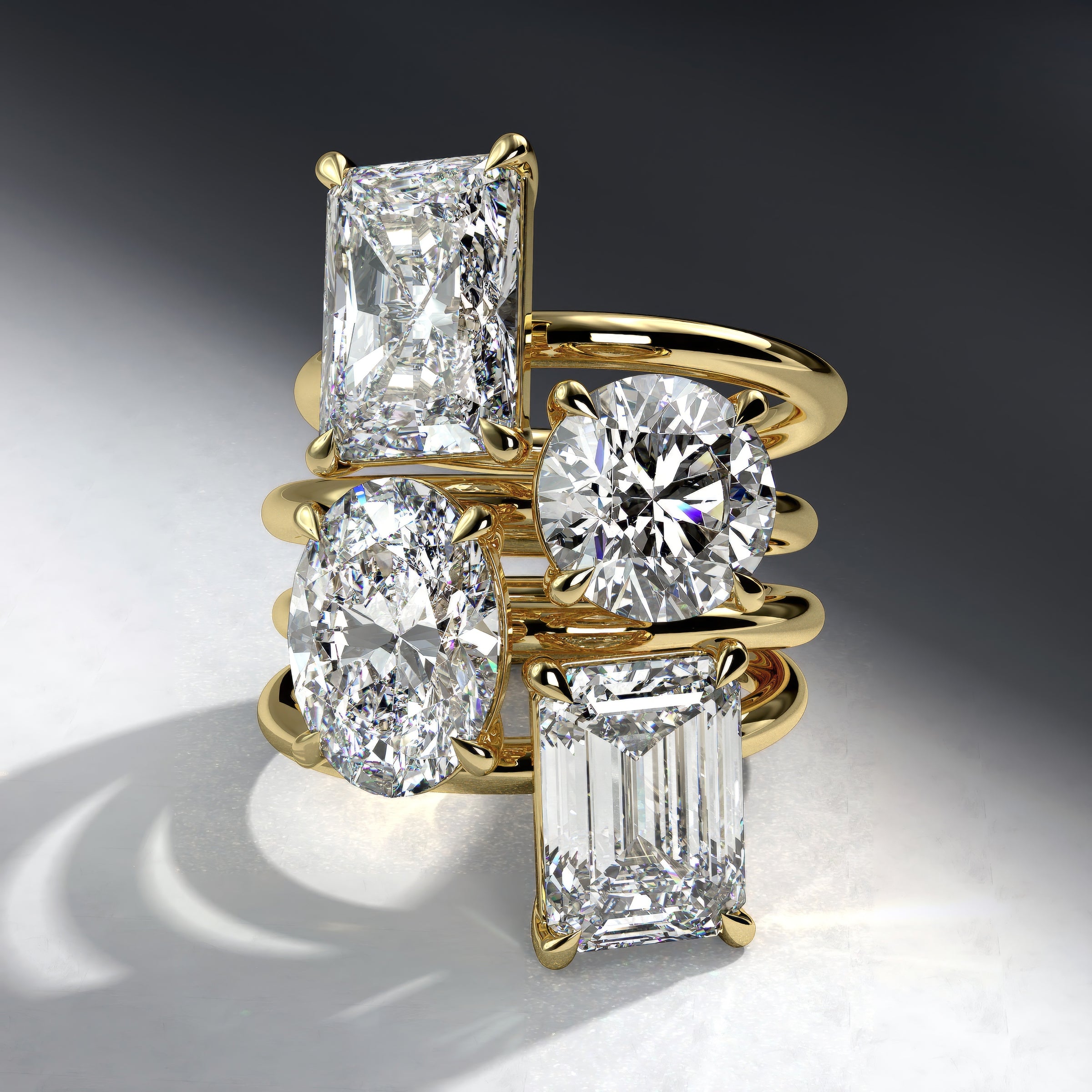 engagement ring stack with various diamonds shapes on a gradient background